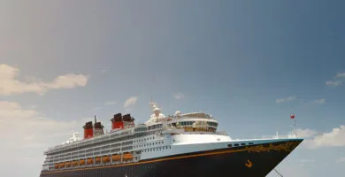 Luxury Cruise ship anchored in the ocean - Cadillac Travel