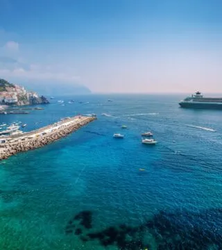 cruise ship of the coast of town in the med - Cadillac Travel