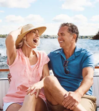 couple enjoying a river cruise - Cadillac Travel, Detroit, MI