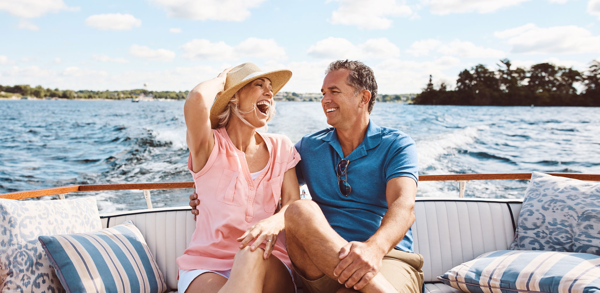 couple enjoying a river cruise - Cadillac Travel, Detroit, MI