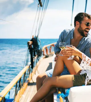 Couple on a small boat - Cadillac Travel