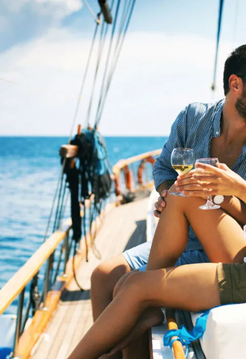 Couple on a small boat - Cadillac Travel