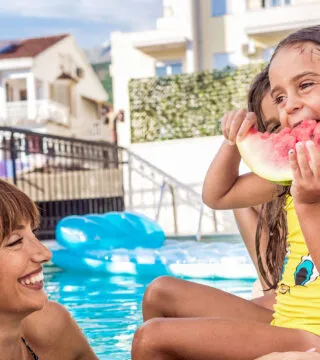 Family at a poolside - Cadillac Travel