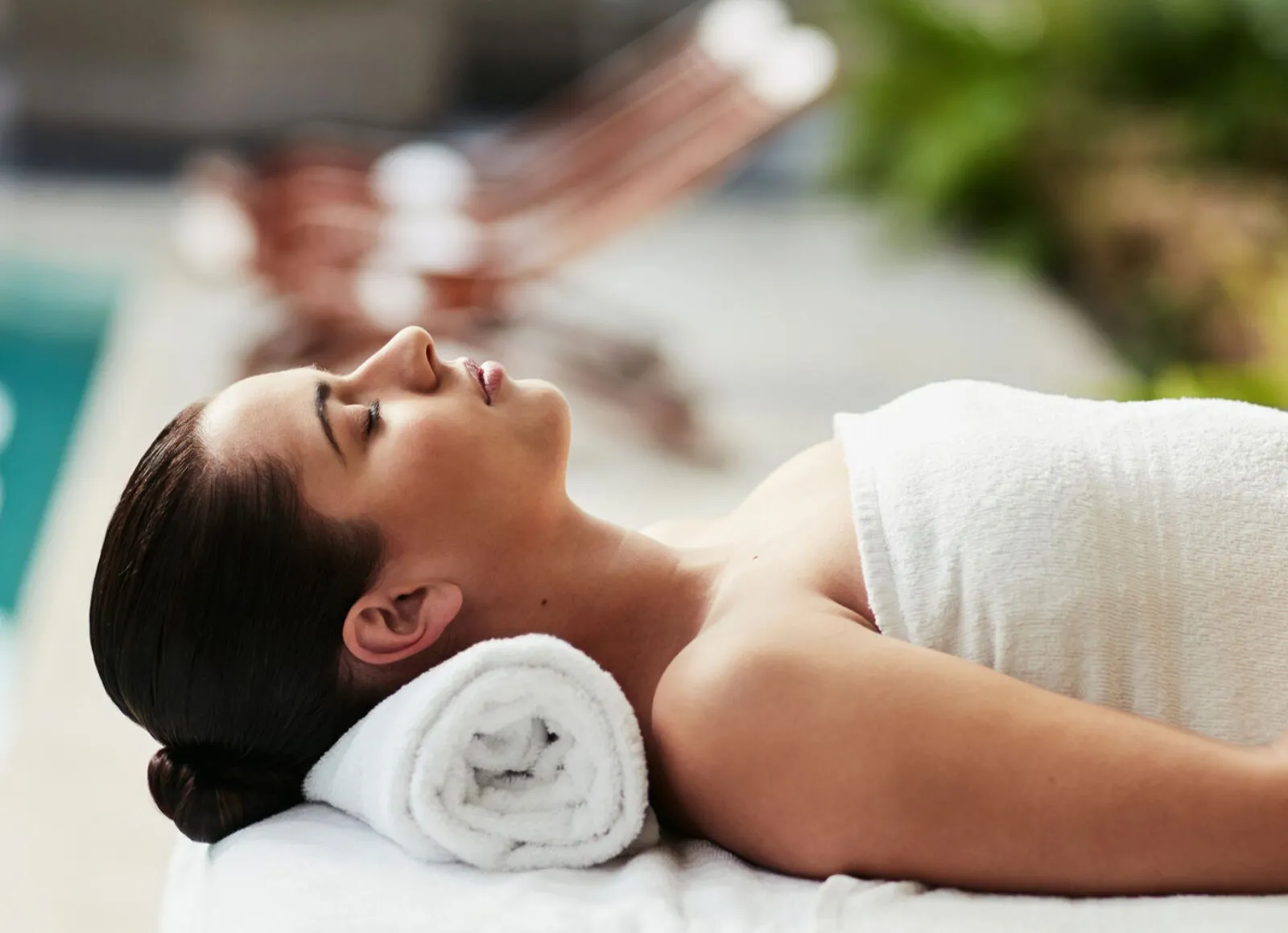 Lady relaxing on a sunbed - Cadillac Travel