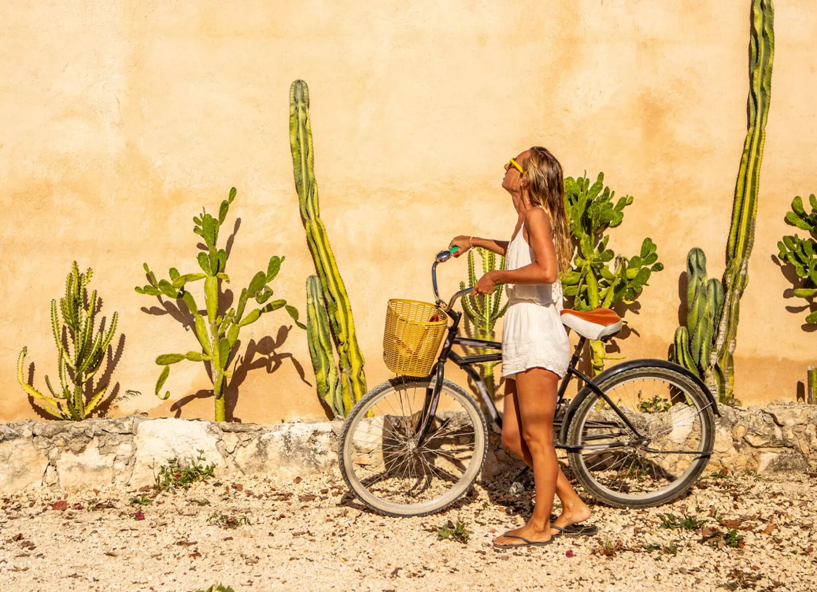 woman on a bike admiring the plants - Cadillac Travel