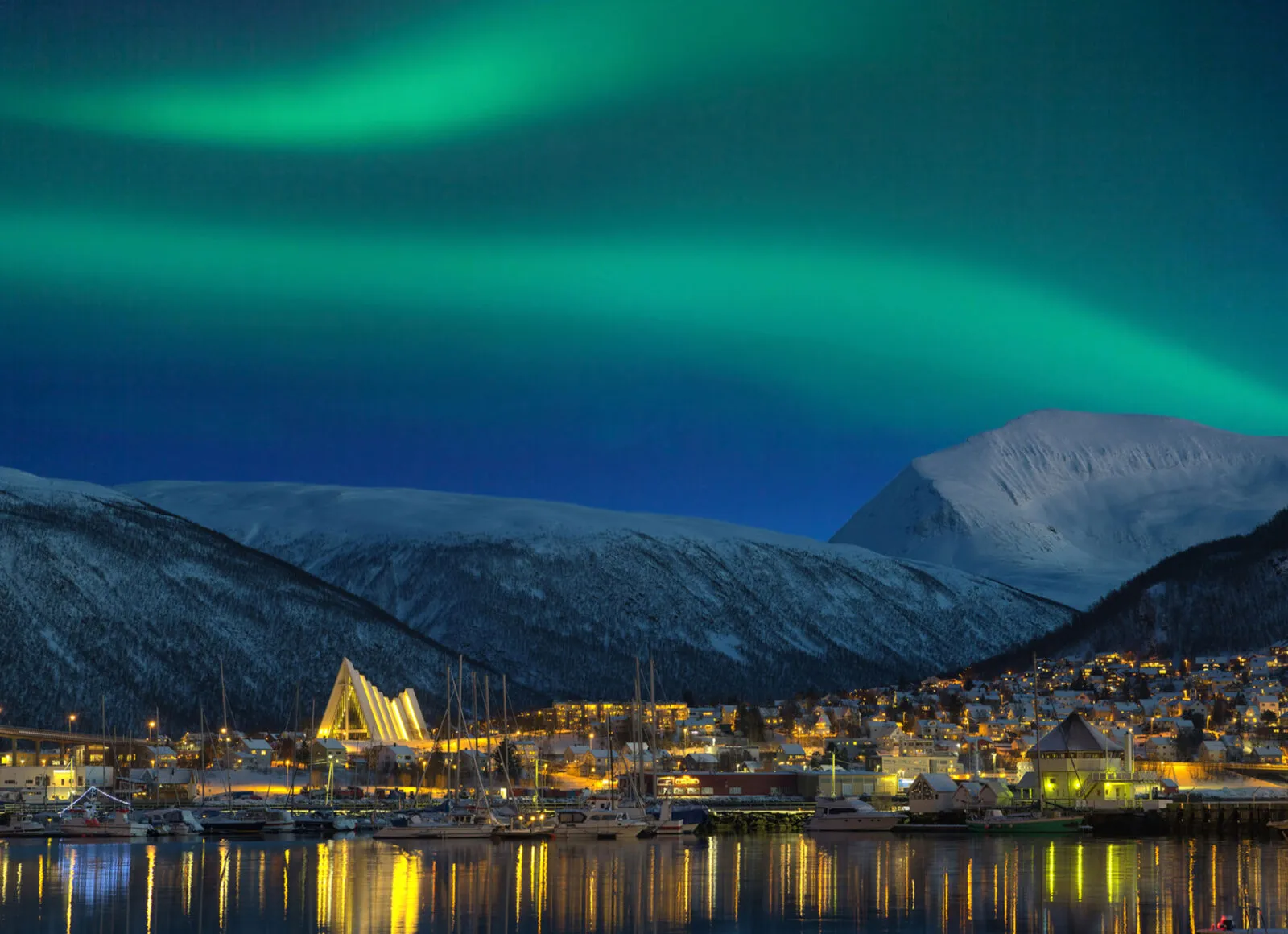 Aurora over snow mountains in the background - Cadillac Travel, Detroit, MI