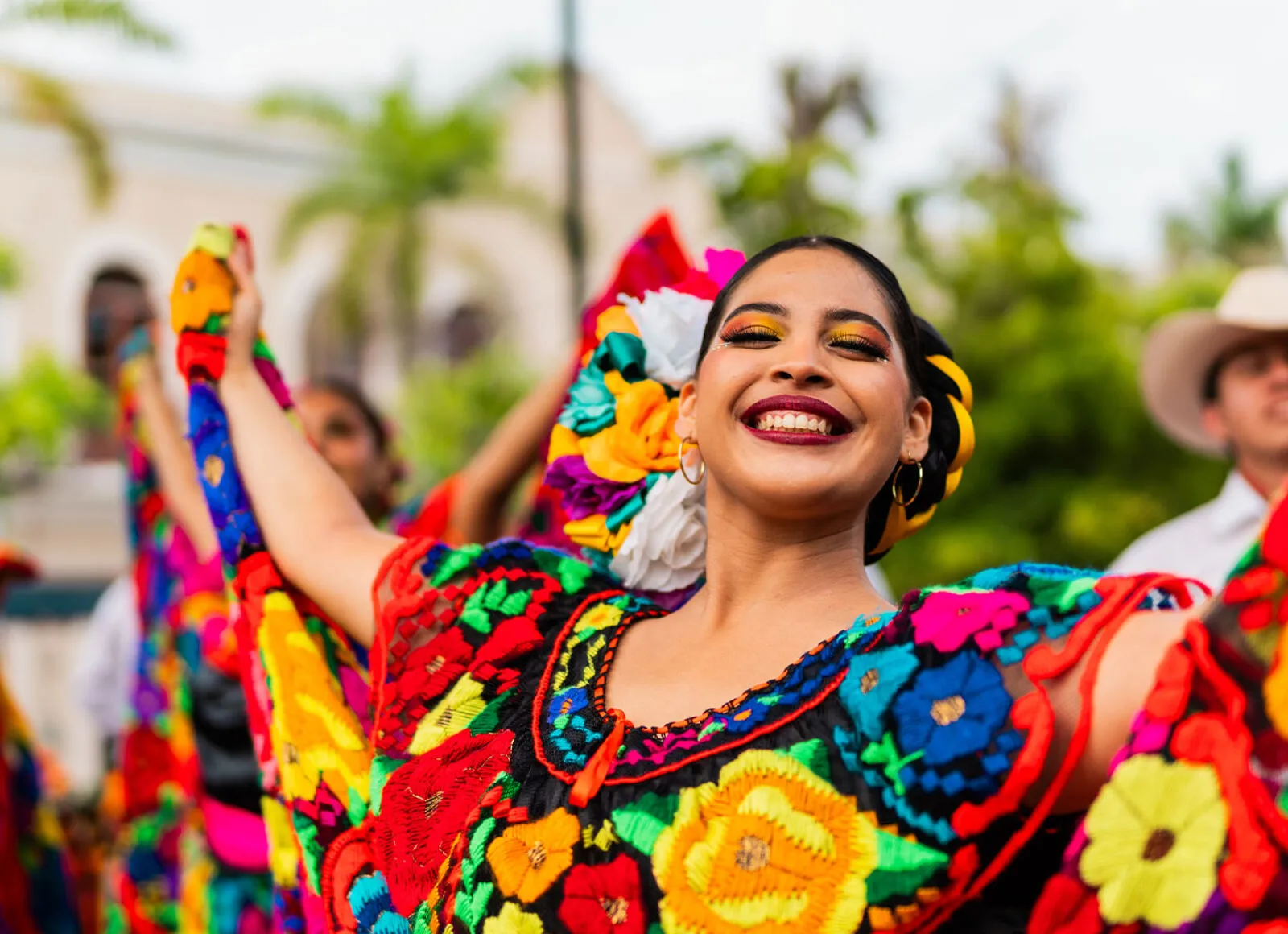 mexican festival with woman dancing - Cadillac Travel, Detroit, MI