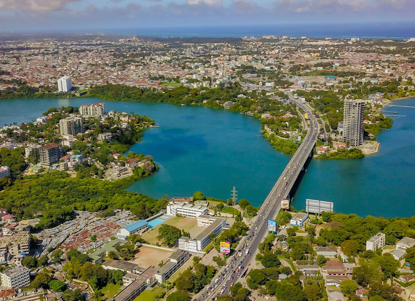 panama canal with large bridge and city in the background - Cadillac Travel, Detroit, MI