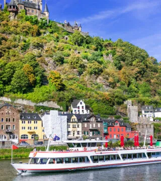 River Cruise through Europe with historic castle in the background - Cadillac Travel, Detroit, MI
