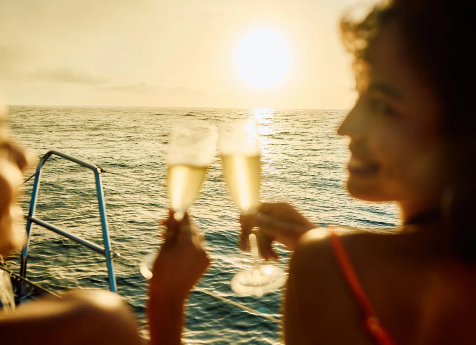Small ship cruises with two people enjoying a glass of champagne - Cadillac Travel, Detroit, MI