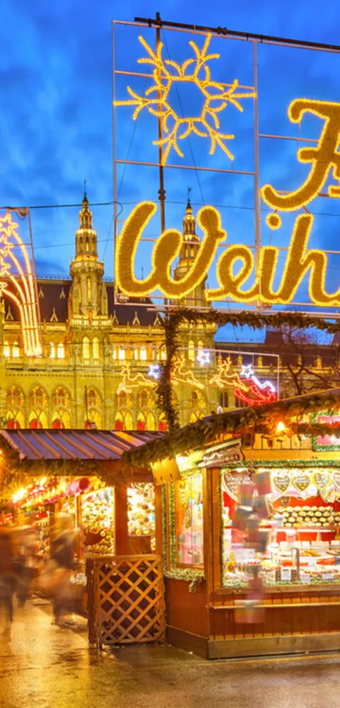 Vienna market at night with christmas lights on - Cadillac Travel
