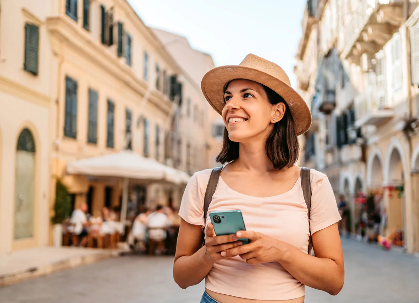 femail tourist enjoying greek architecture - Cadillac Travel